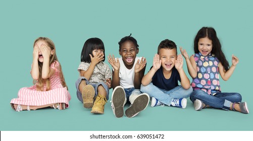 Diverse Group Of Kids Playing Together And Cover Face 