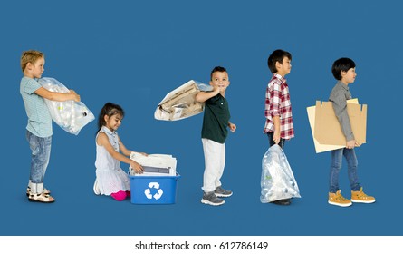 Diverse Group Of Kids Recycling Garbage