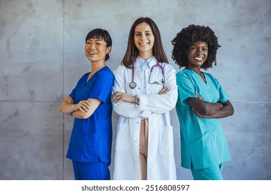 A diverse group of medical professionals, including doctors and nurses, standing confidently and smiling in a hospital setting. They demonstrate teamwork, healthcare professionalism - Powered by Shutterstock