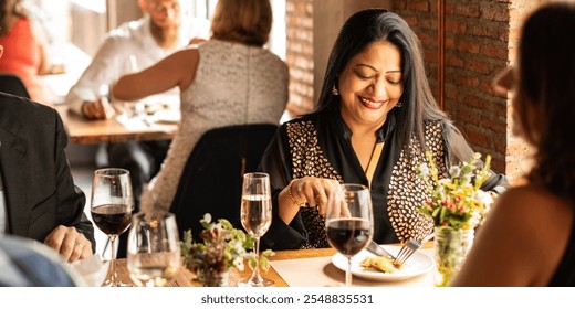 A diverse group of people enjoying a meal in a cozy restaurant. The scene features group of diverse friends sharing laughter and good food together. - Powered by Shutterstock