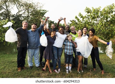 Diverse Group Of People Pick Up Trash In The Park Volunteer Community Service