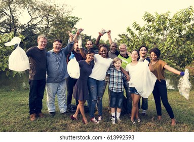 Diverse Group Of People Pick Up Trash In The Park Volunteer Community Service