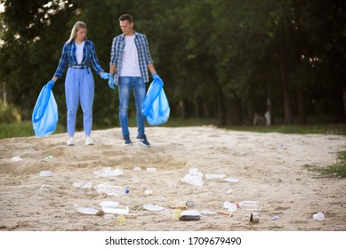 Diverse Group Of People Picking Up Trash In The Park Volunteer Community Service