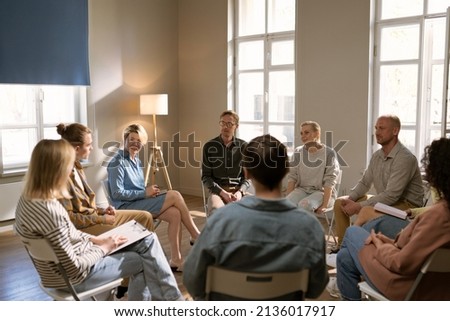 Diverse group of people sat in circle for a Therapy recovery meeting Stock fotó © 