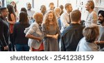 Diverse group of people socializing at a casual gathering. Men and women of various ethnicities engaged in conversation, enjoying a lively social event. Diverse people mingle at a social event.