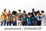 Diverse group of people standing hugging, embracing each other facing away. Unity and diversity. Mixed ethnicities, men and women, embracing diversity and togetherness.