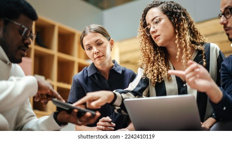 Diverse Group of People Talking in a Casual Modern Meeting Room in Office. Group of Colleagues From Different Ethnicities Working Together as a Team on Crisis Management. Wide Shot - Shutterstock ID 2242410119