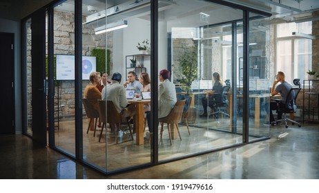Diverse Group of Professional Businesspeople Meeting in the Modern Office Conference Room. Creative Team Discuss App Design, Analyze Data, Plan Marketing Strategy, Disrupt Social Media, Growth Hack