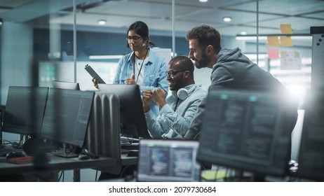 Diverse Group of Professionals Meeting in Modern Office: Brainstorming IT Programmers Use Computer Together, Talk Strategy, Discuss Planning. Software Engineers Develop Inspirational App Program - Shutterstock ID 2079730684