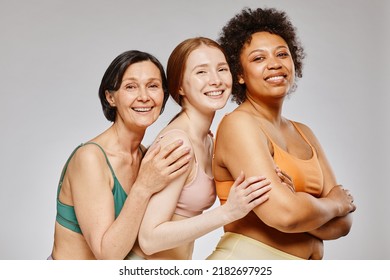 Diverse Group Of Real Women Wearing Underwear And Smiling Happily Against Grey Background, Body Positivity