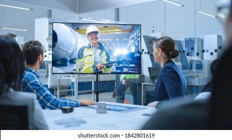 Diverse Group Of Specialists, Managers In The Factory Office Meeting Room, Have Conference Video Call With Factory Chief Female Engineer, She Talks About Production Growth, Uses Tablet Computer