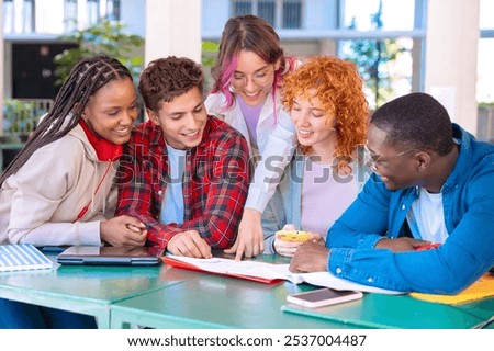 Diverse group of students collaborating at table