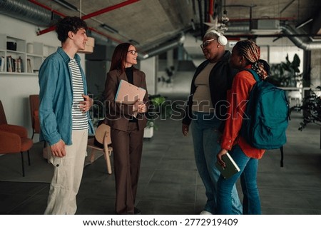 Diverse group of students and professors having an informal discussion in a modern campus environment, promoting education and connection