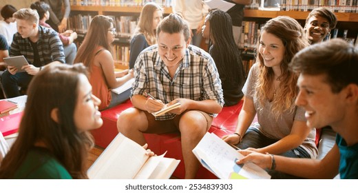 Diverse group of students study in library, read books, group discussion. Diverse group of students collaborative in school library. Diverse college students focus on books in groups in library