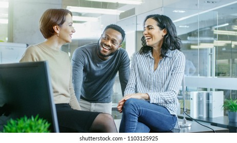 Diverse Group Of Talented Young Professionals Chatting, Joking And Having Fun On A Coffee Break. Stylish Young People In Modern Office.