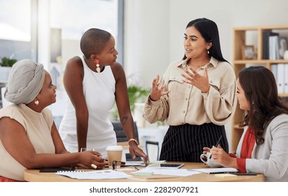 Diverse group, teamwork and young business women brainstorming, collaboration or cooperation. Ambitious confident professional team of colleagues talking and planning a marketing strategy together - Powered by Shutterstock