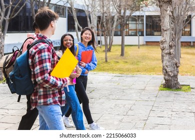 Diverse Group Of Teenage Student Friends Walking After Classes Outside At High School - Education And Academic Concept - Copy Space For Text