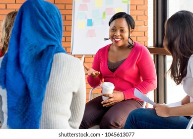 Diverse Group Of Women In Colorful Clothes At The Meeting, Discussing Social Project