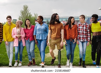 Diverse Happy Group Of People Having Fun Outdoor - Focus On Man With Prosthesis On Leg