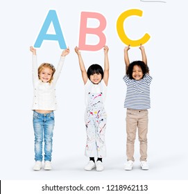 Diverse Happy Kids Learning The ABC