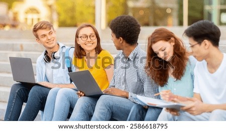 Diverse High-School Students Doing Homework Learning Together Sitting On Steps Outside. School Life Concept