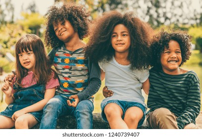 Diverse Kids Group Smiling Playing In Park.