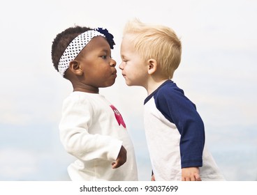 Diverse Little Kids about to Kiss