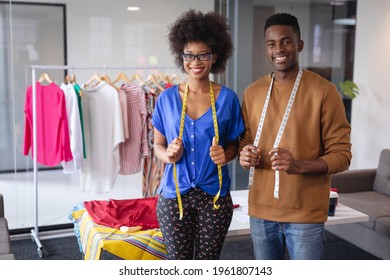 Diverse male and female fashion designers at work with tailor centimeters on necks. independent creative design business. - Powered by Shutterstock