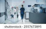 Diverse Male and Female Medical Professionals Navigate a Busy Hospital Corridor and Registration Area, Having Conversations About Healthcare. Male Nurse Assists a Patient in a Wheelchair