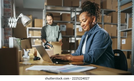 Diverse Male and Female Warehouse Inventory Managers Talking, Using Laptop Computer and Checking Retail Stock. Rows of Shelves Full of Cardboard Box Packages in the Background. - Powered by Shutterstock