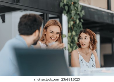 Diverse marketing team strategizing campaigns, analyzing data and optimizing online advertising in a modern office. Expertise in targeting, teamwork, and driving successful business outcomes. - Powered by Shutterstock