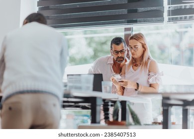 Diverse marketing team works together in modern office to optimize campaigns and reach target audience through digital channels for high ROI. - Powered by Shutterstock