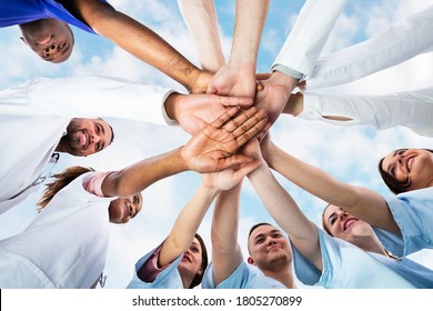 Diverse Medical Team Staff Hands Stack Outdoors - Powered by Shutterstock