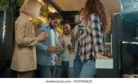 Diverse men women freelancers coworkers dancers friends happy joyful girls guys male female dance music business team office colleagues dancing in bar coworking celebrate corporate party coffee break - Powered by Shutterstock