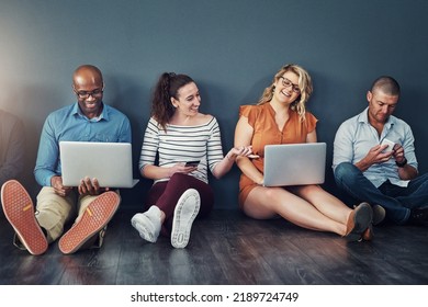 Diverse Modern Group Of Business People Sitting On Social Media Networking Apps On Their Digital Devices. Creative Team Of Work Colleagues Connected Online With Laptop Pcs And Phones