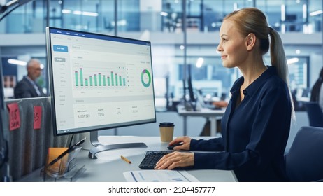 Diverse Modern Office: Confident Businesswoman Using Desktop Computer with Big Data Statistics, Graphs. Manager Working on e-Commerce Support, Project Marketing, Data Analysis