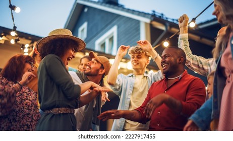 Diverse Multicultural Friends and Family Dancing Together at an Outdoors Garden Party Celebration. Young and Senior People Having Fun on a Perfect Summer Afternoon. - Shutterstock ID 2227917455