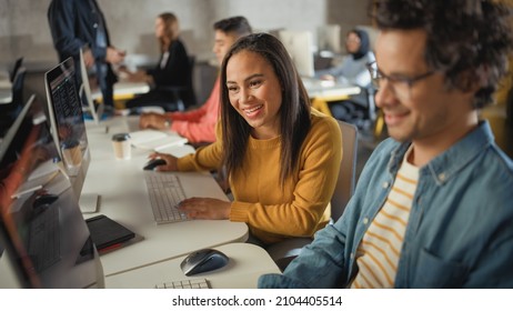 Diverse Multiethnic Group Of Female And Male Students Sitting In College Room, Collaborating On School Projects On A Computer. Young Scholars Study, Talk, Apply Academic Skills And Knowledge In Class.