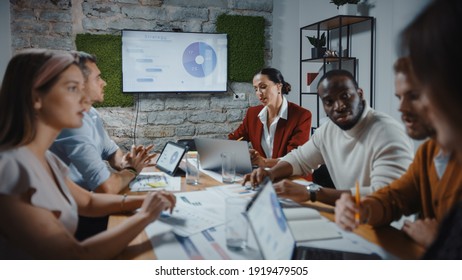 Diverse Multi-Ethnic Team of Start-up Entrepreneurs, Business People Have Meeting in the Modern Office Conference Room. Creative Team Discuss Marketing Strategy, Data Analysis - Powered by Shutterstock