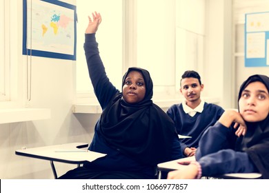 Diverse Muslim Children Studying In A Classroom
