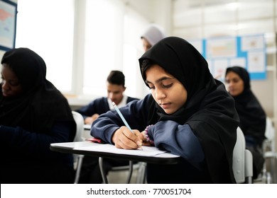 Diverse Muslim Children Studying In Classroom
