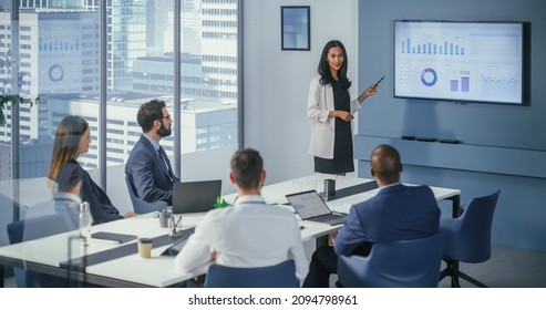 Diverse Office Conference Room Meeting: Asian Female Project Manager Presents Digital Business Expansion Strategy For Investment Team, Uses Wall TV With Big Data Analysis, E-Commerce Infographics.