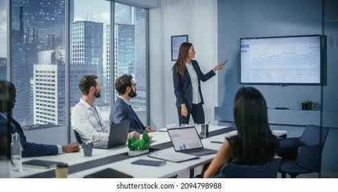 Diverse Office Conference Room Meeting: Successful Female Executive Director Presents e-Commerce Fintech Growth Statistics to a Group of Investors. Wall TV with Big Data Analysis, Infographics - Shutterstock ID 2094798988