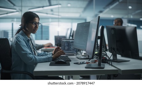 Diverse Office: Indian IT Programmer Working On Desktop Computer. Female Specialist Creating Innovative Software Engineer Developing App, Program, Video Game. Terminal With Coding Language.