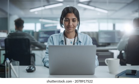 Diverse Office: Portrait Of Beautiful Indian IT Programmer Working On Desktop Computer, Smiling. Female Software Engineer Creating Innovative App, Program, Video Game