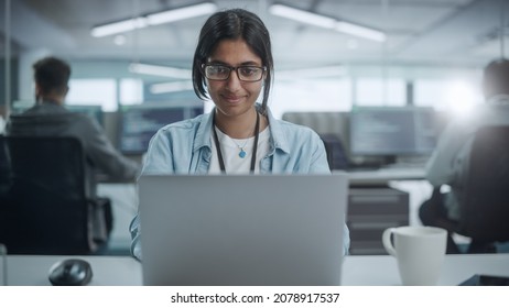 Diverse Office: Portrait Of Smiling Indian IT Programmer Working On Desktop Computer. Female Specialist Create Innovative Software. Professional Engineer Develop App.