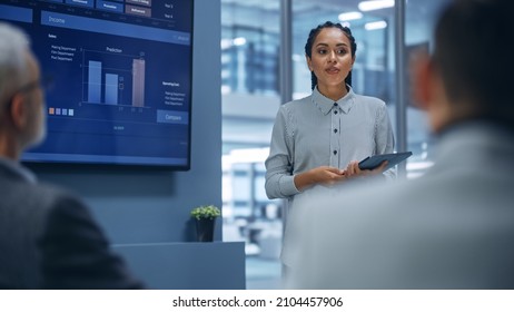 Diverse Office Product Presentation: Successful Black Female Digital Entrepreneur Uses TV Screen With Big Data, Statistics, Talks About Company Growth, Discusses Strategy With Investors, Managers