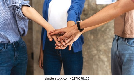 Diverse People Group Stacked Joined Hands In Pile, Multiethnic Team Friends Students Together As Racial Unity Concept, Partnership Coaching Training, Teambuilding, Support In Teamwork.