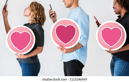 Diverse people holding valentine icons - Shutterstock ID 1115246969