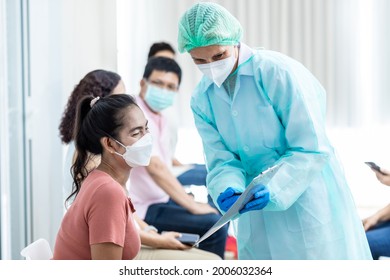 Diverse People Line Up Sit And Wait In Line To Get Vaccinated. Female Doctor Asks Information On Vaccination Patients Hospital Young People And Elderly People Queue For Vaccination Against Coronavirus